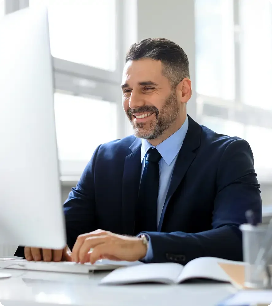 Senior executive reviewing B2B sales outsourcing strategy with a vetted provider through Starlit consulting